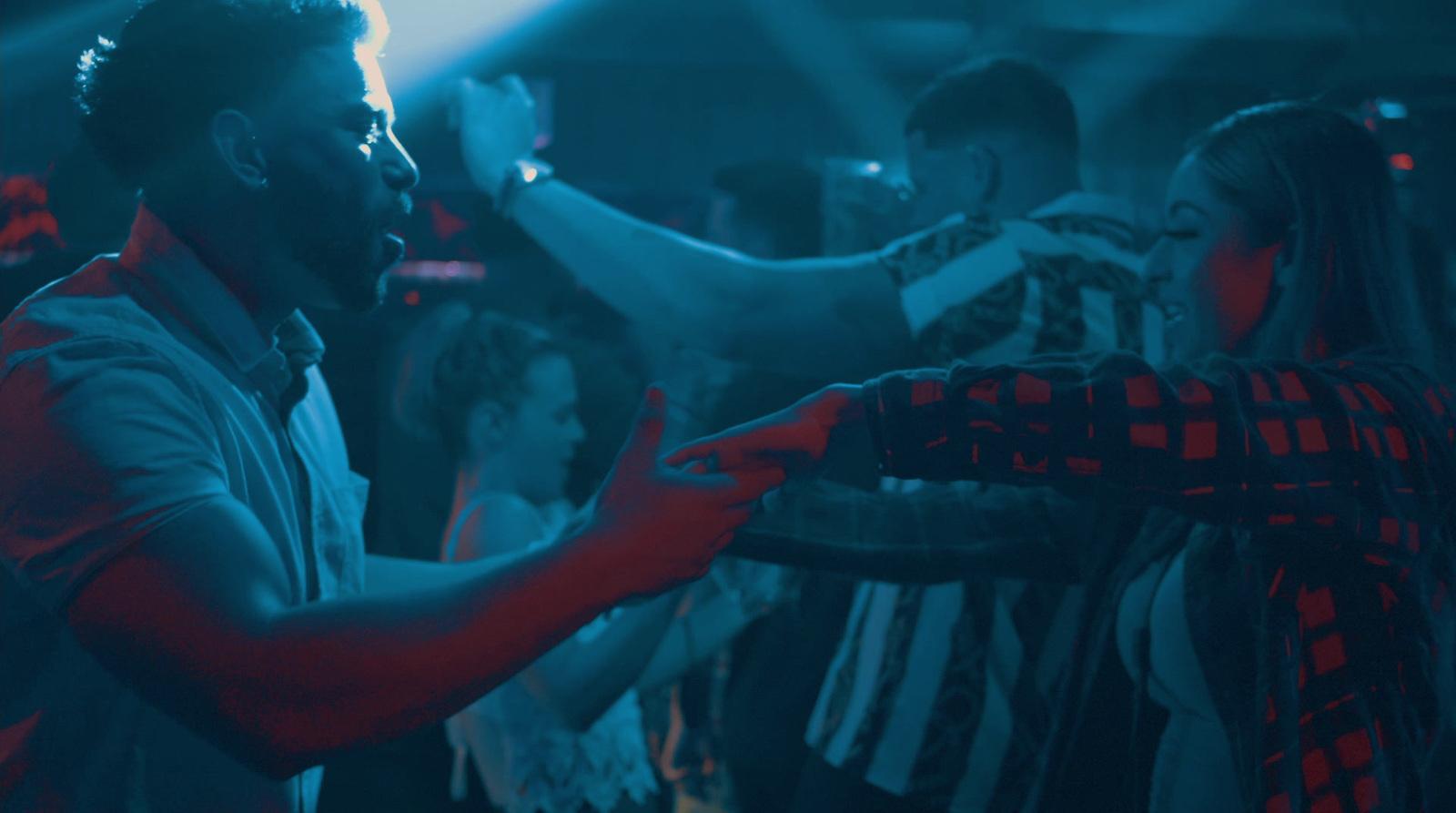 a group of people dancing at a party