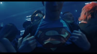 a group of people standing around each other