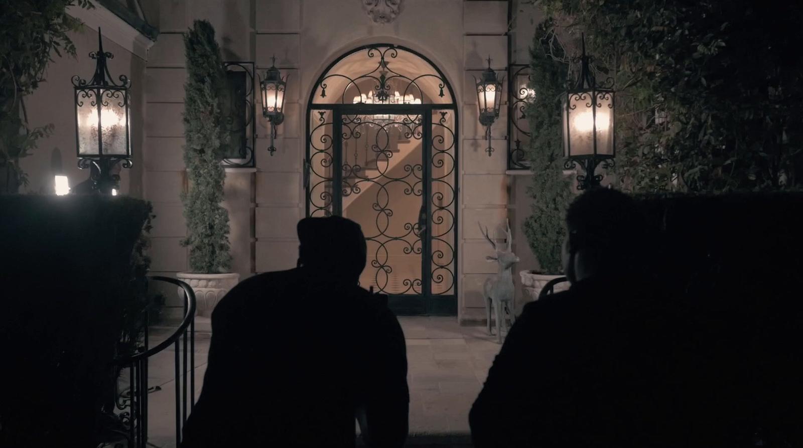 a couple of people that are standing in front of a door