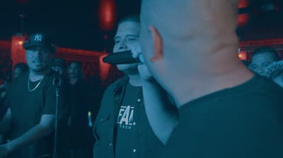 a group of people standing around each other