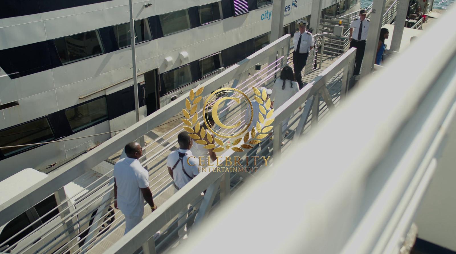 a group of people walking across a bridge