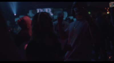 a group of people standing around at a party