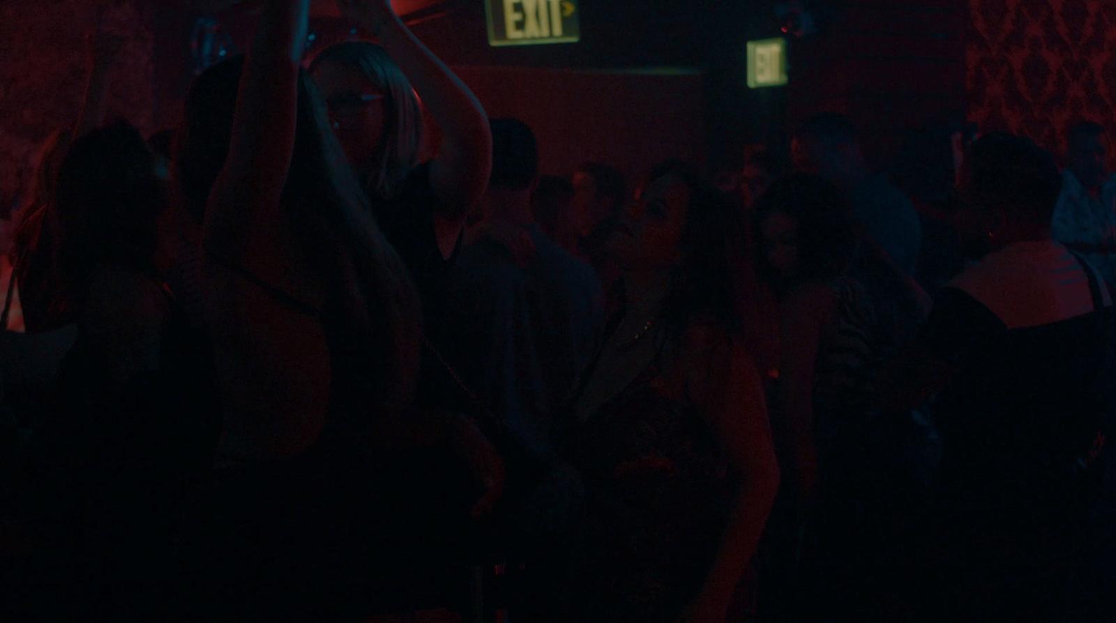 a group of people standing in a dark room