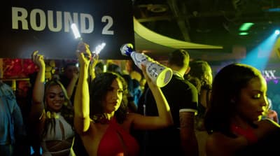 a group of people dancing at a party
