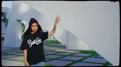 a woman wearing a black shirt and a beanie