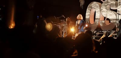 a group of people standing on top of a stage