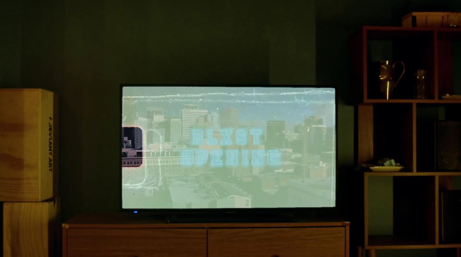 a flat screen tv sitting on top of a wooden dresser