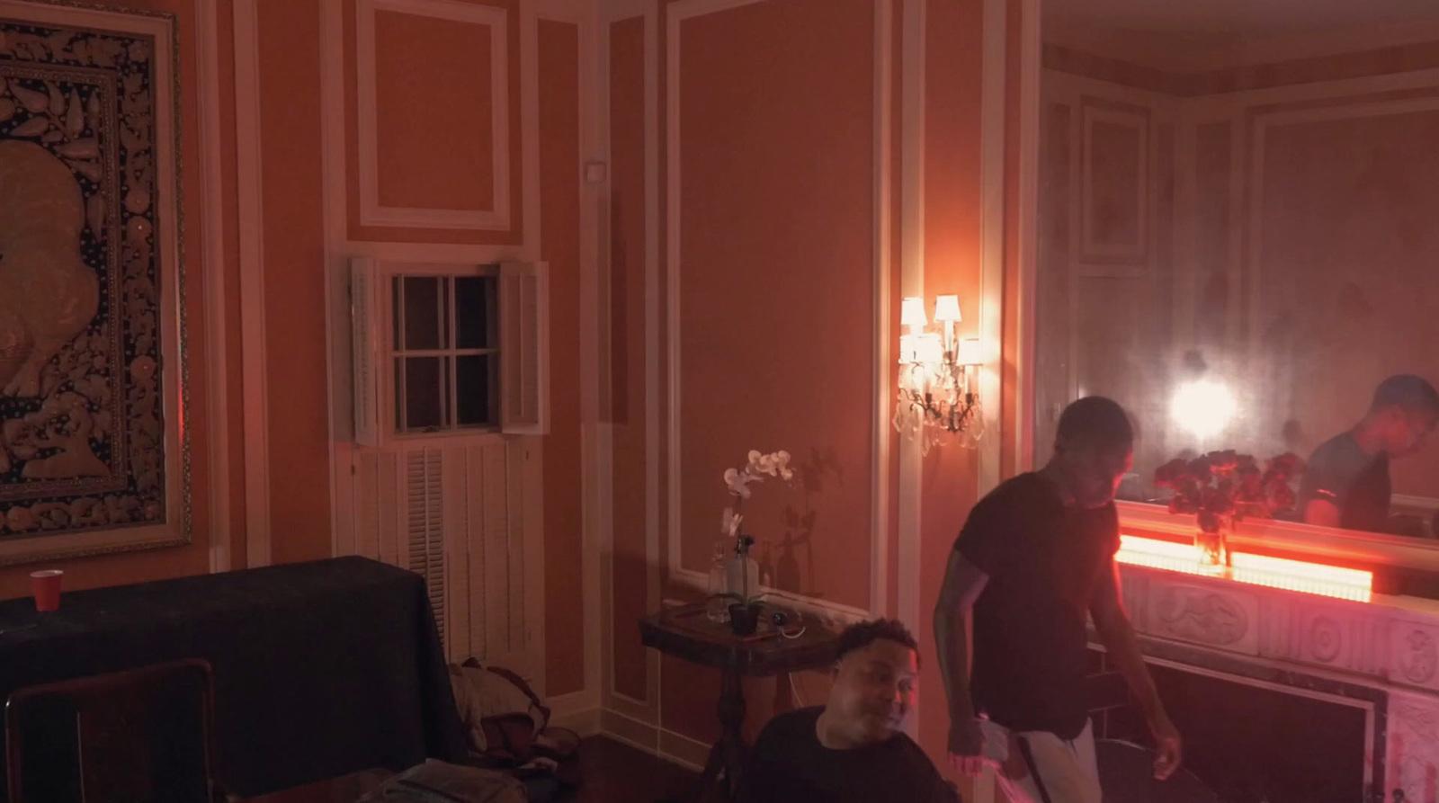 a man standing in front of a mirror in a living room