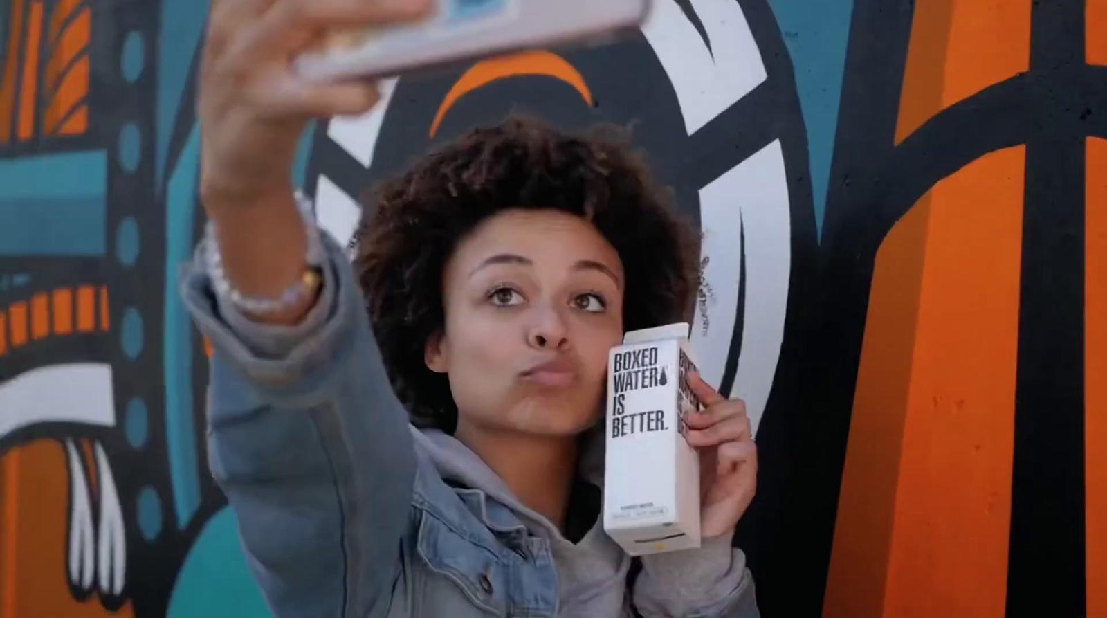 a woman taking a selfie with her cell phone