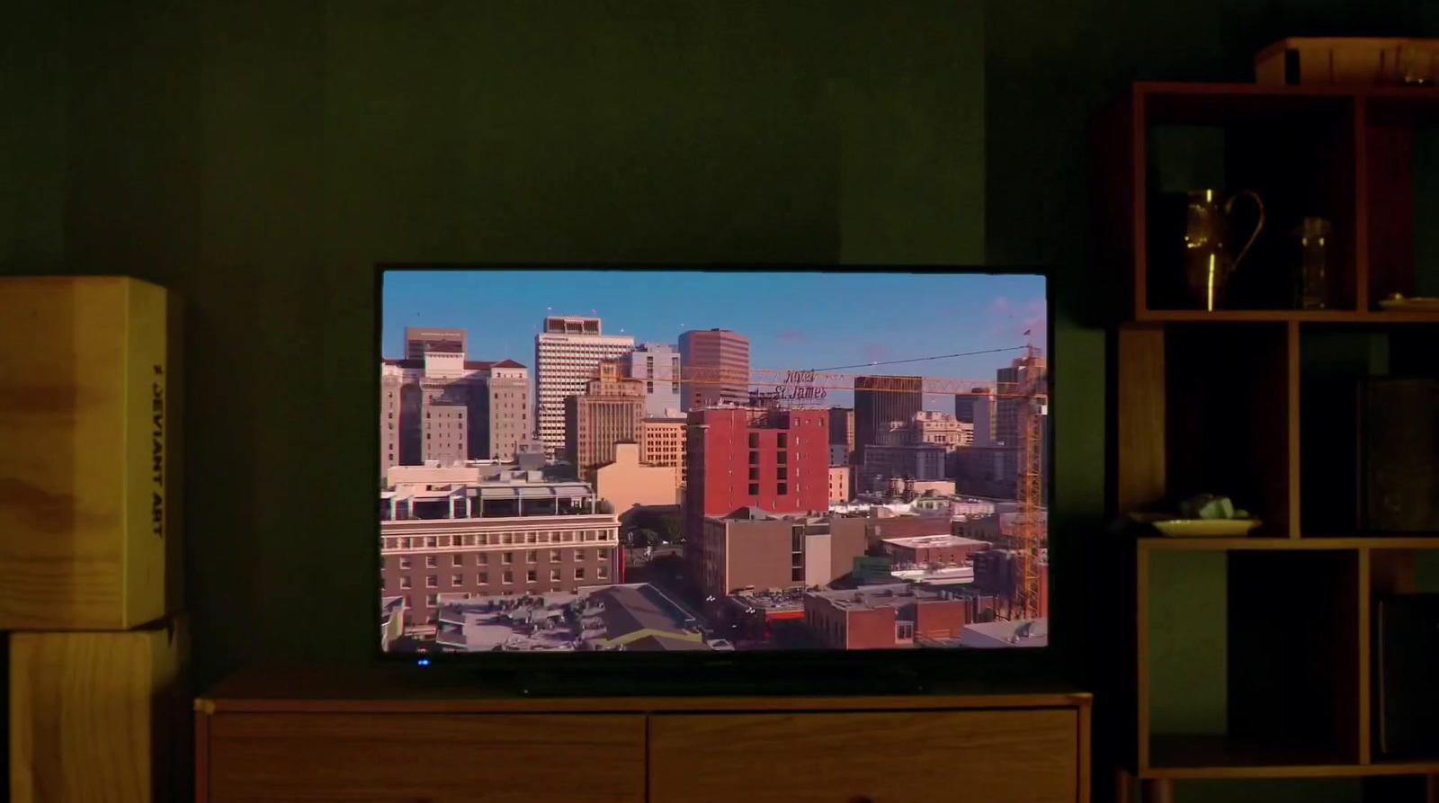 a flat screen tv sitting on top of a wooden dresser