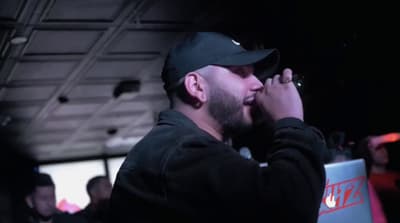 a man with a beard and a black hat