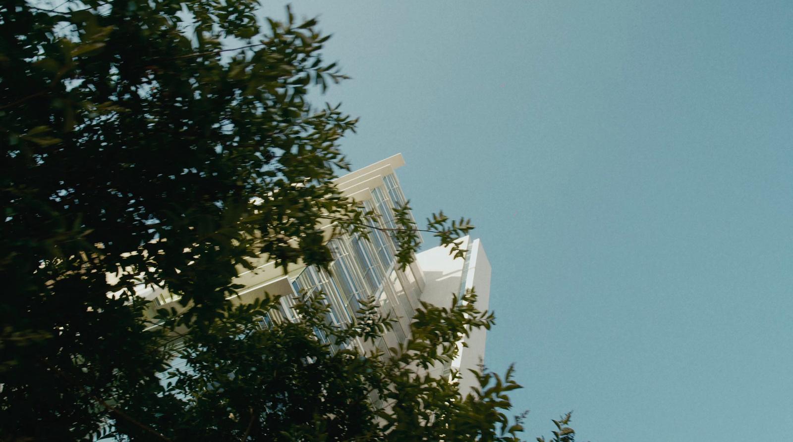 a tall building with a clock on the side of it