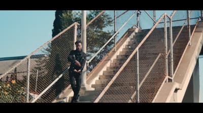 a man walking up a set of stairs
