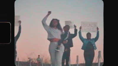 a group of people holding up signs in the air