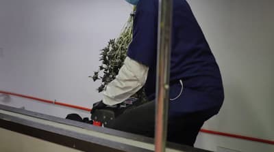 a man riding a skateboard down a metal rail