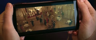 a person taking a picture with a cell phone