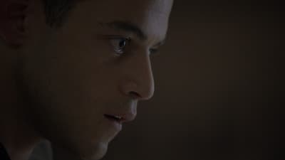 a close up of a man staring off into the distance