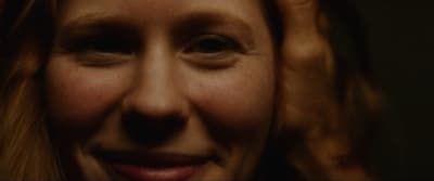 a close up of a woman with red hair