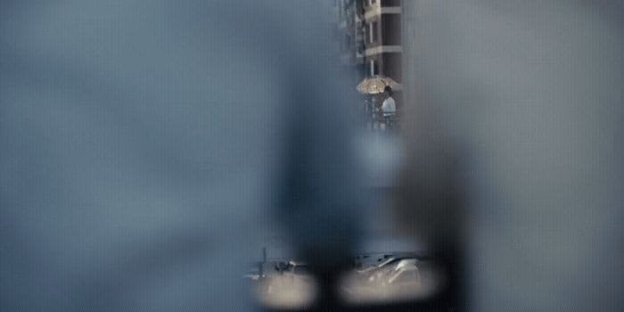 a reflection of a building in a mirror