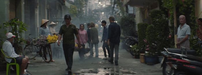 a group of people walking down a street