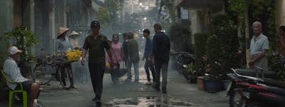 a group of people walking down a street