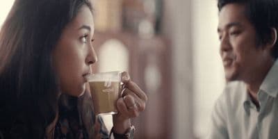 a man and a woman drinking coffee together