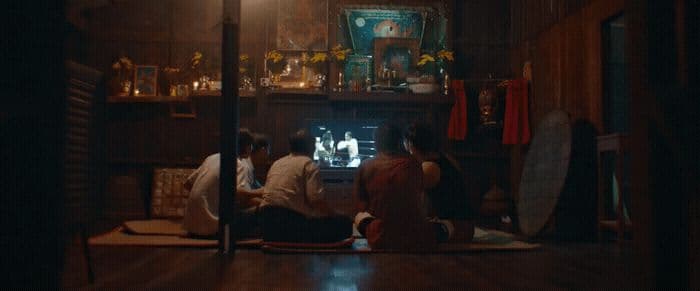 a group of people sitting on the floor in a room