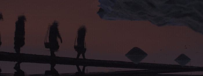 a group of people walking across a bridge