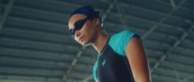 a woman in a swimming suit and goggles