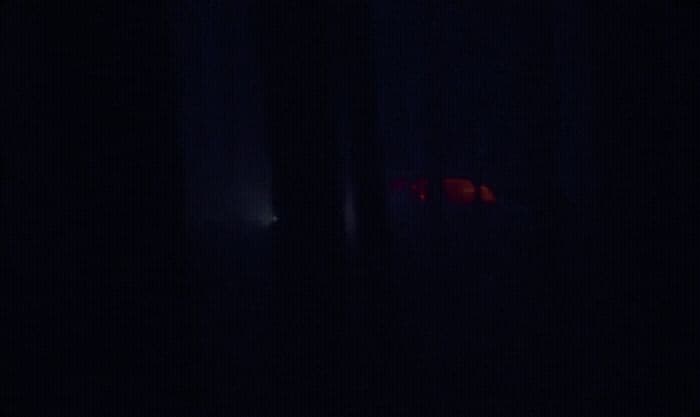 a blurry image of a red object in the dark