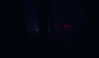 a blurry image of a red object in the dark