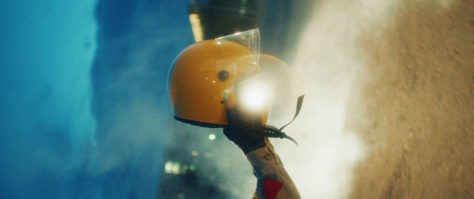 a close up of a helmet on a scooter