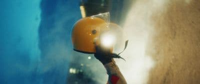 a close up of a helmet on a scooter