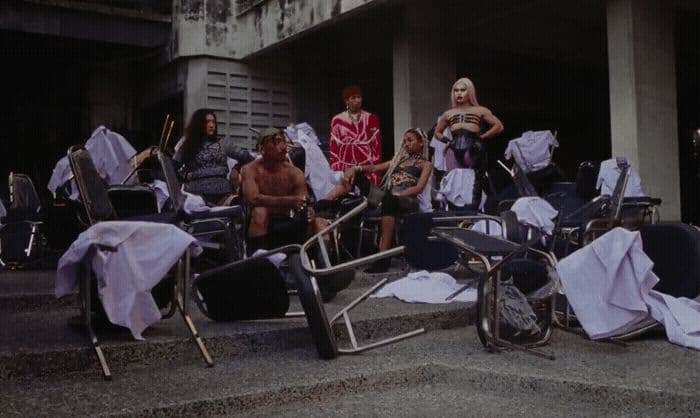 a group of people sitting on top of a set of stairs