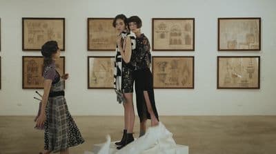 a group of people that are standing in a room