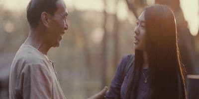 a man and a woman standing next to each other