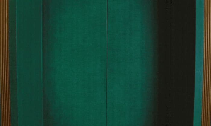 a room with a green wall and a wooden door