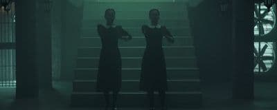 a couple of women standing next to each other