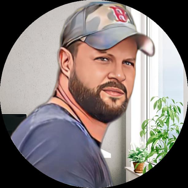 a man with a beard and a baseball cap