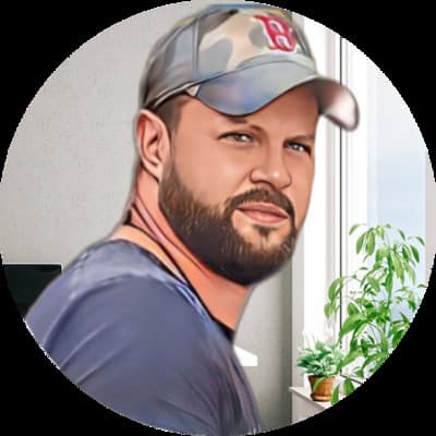 a man with a beard and a baseball cap