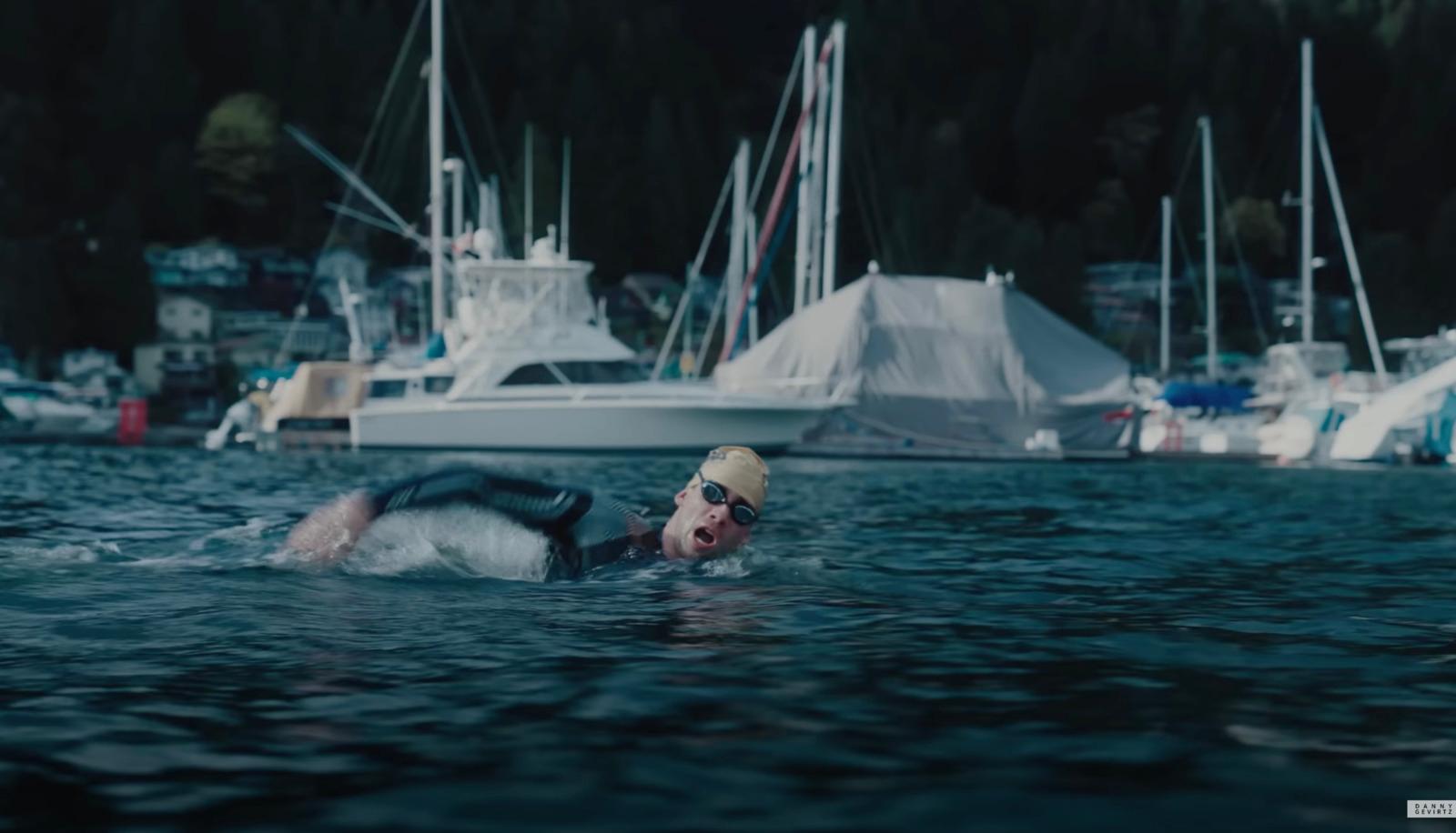 a man swimming in a body of water