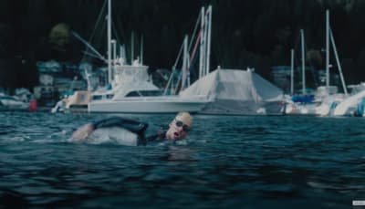 a man swimming in a body of water