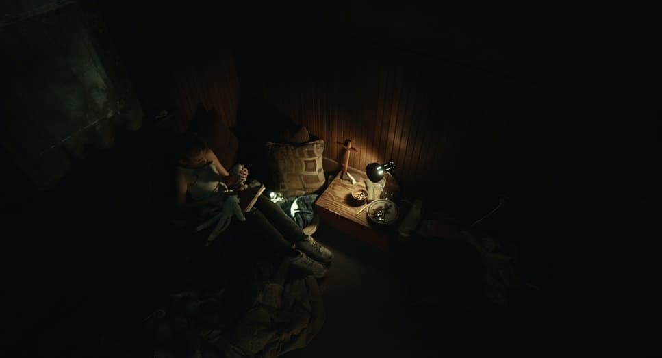 a couple of people sitting in a dark room
