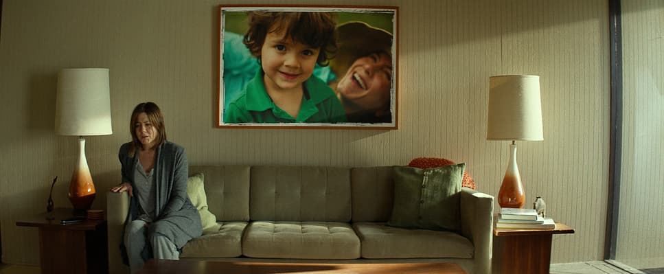 a woman sitting on a couch in a living room