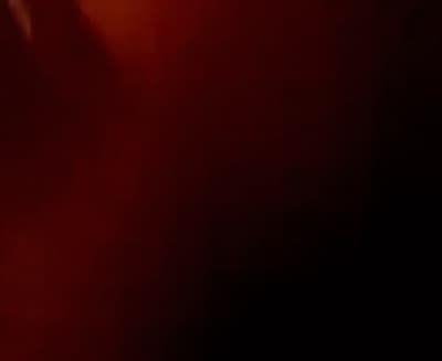 a blurry photo of a person holding a cell phone