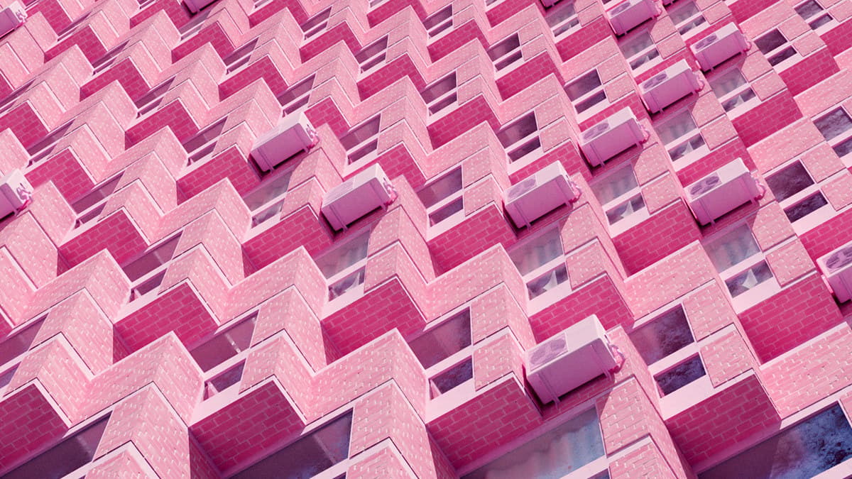 a pink building with a lot of windows