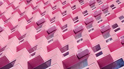 a pink building with a lot of windows