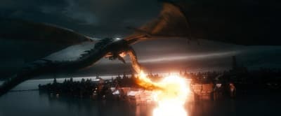 a large dragon flying over a crowd of people