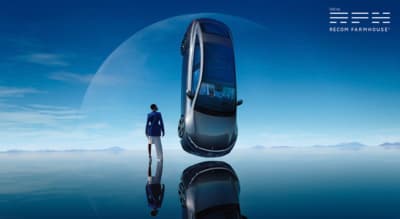 a man standing in front of a futuristic car