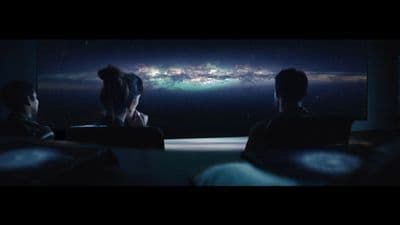 a couple of people sitting in front of a laptop computer